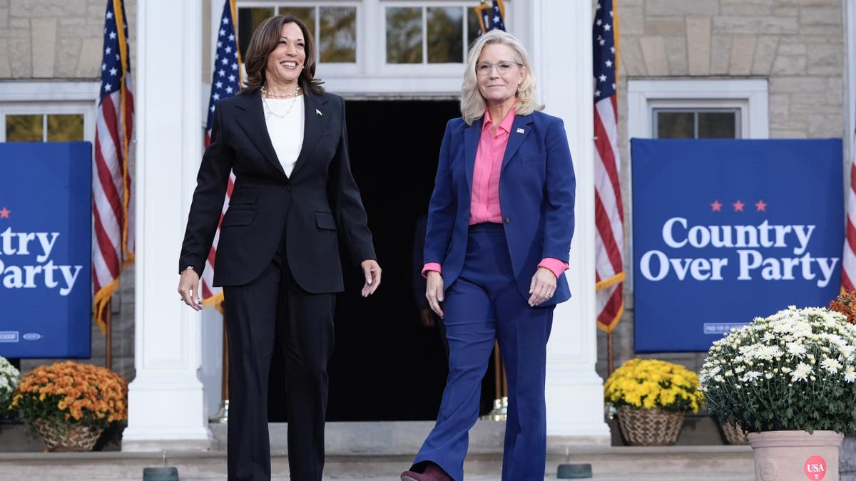 Democratic presidential nominee Vice President Kamala Harris, left, arrives to speak at a campaign event with former Congresswoman Liz Cheney, R-Wyo., right, at Ripon College in Ripon, Wis., Thursday, Oct. 3, 2024. (AP Photo/Mark Schiefelbein)