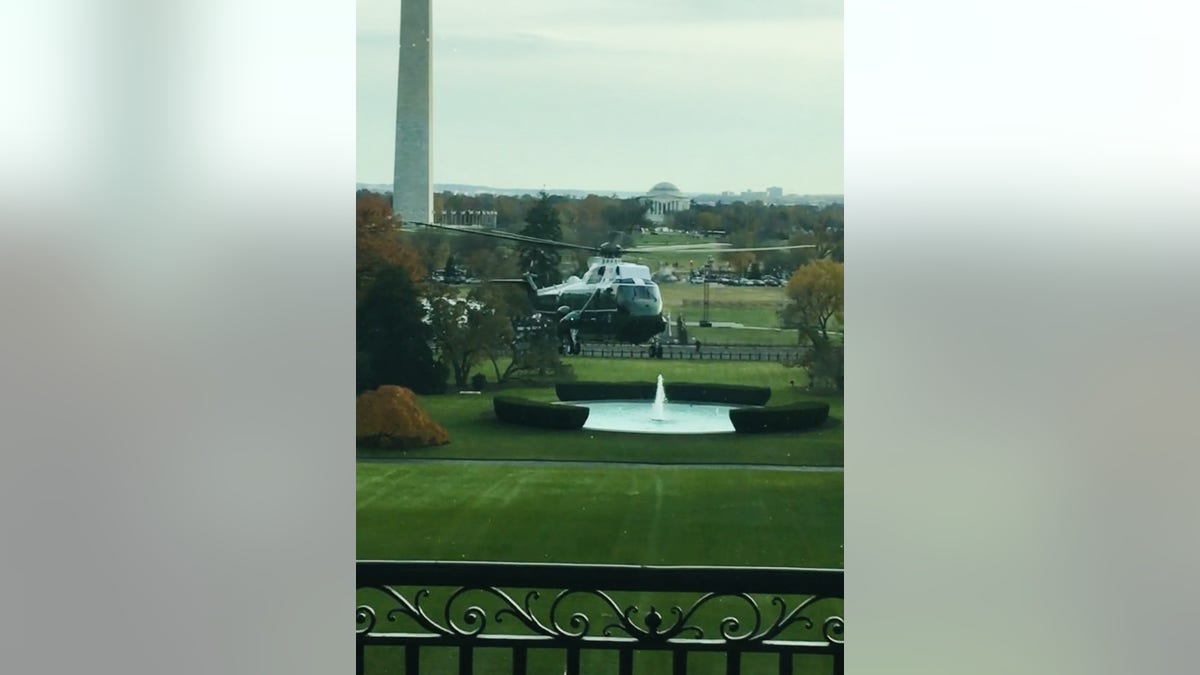 photo of Marine One through a White House window