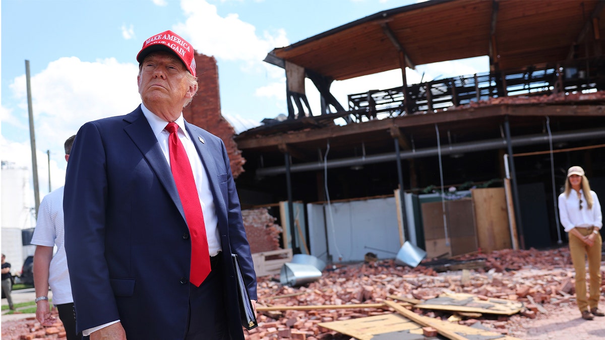 Former President Trump listens to a question as he visits Chez What Furniture Store, which was damaged during Hurricane Helene on Sept. 30, 2024, in Valdosta, Georgia.