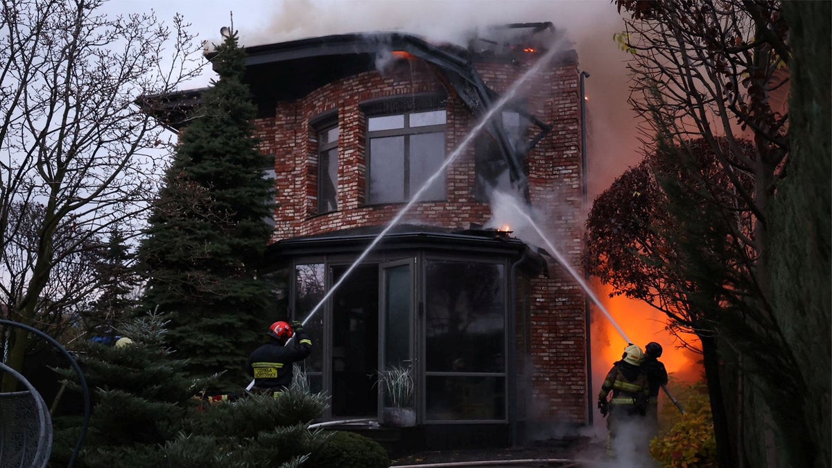 Firefighters work at the site of a Russian missile strike in Dnipro, Ukraine, on Thursday.