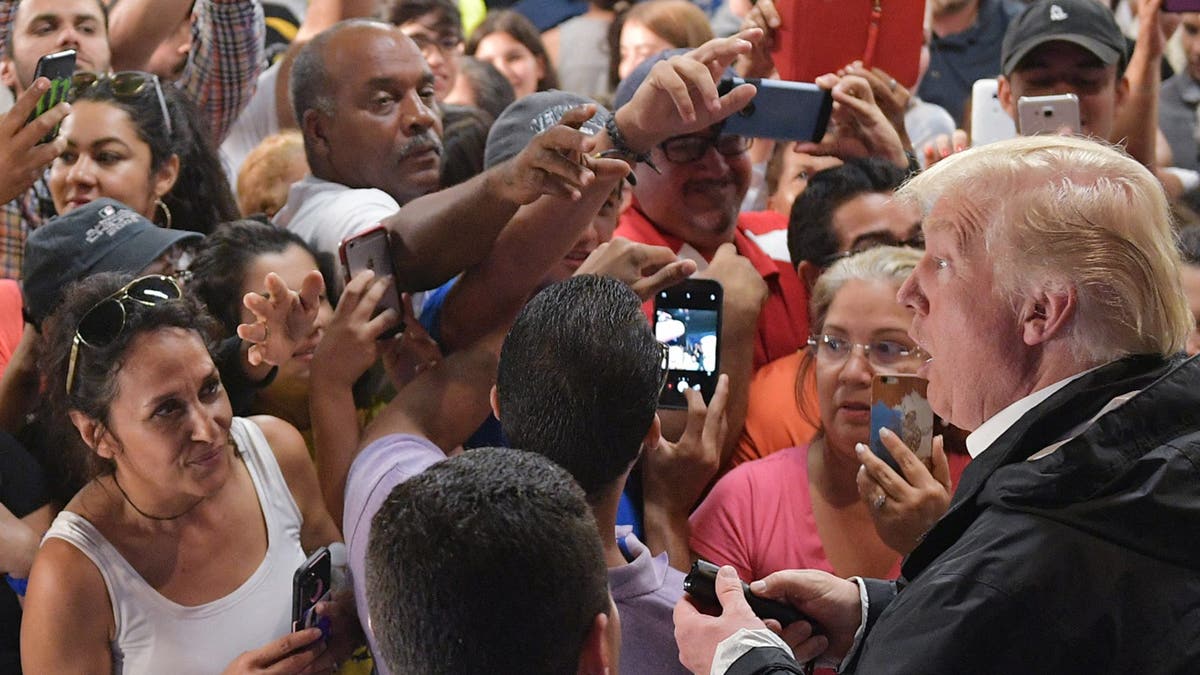 Then-President Trump visits Cavalry Chapel in Guaynabo, Puerto Rico, on Oct. 3, 2017, nearly two weeks after Hurricane Maria rampaged through the region.