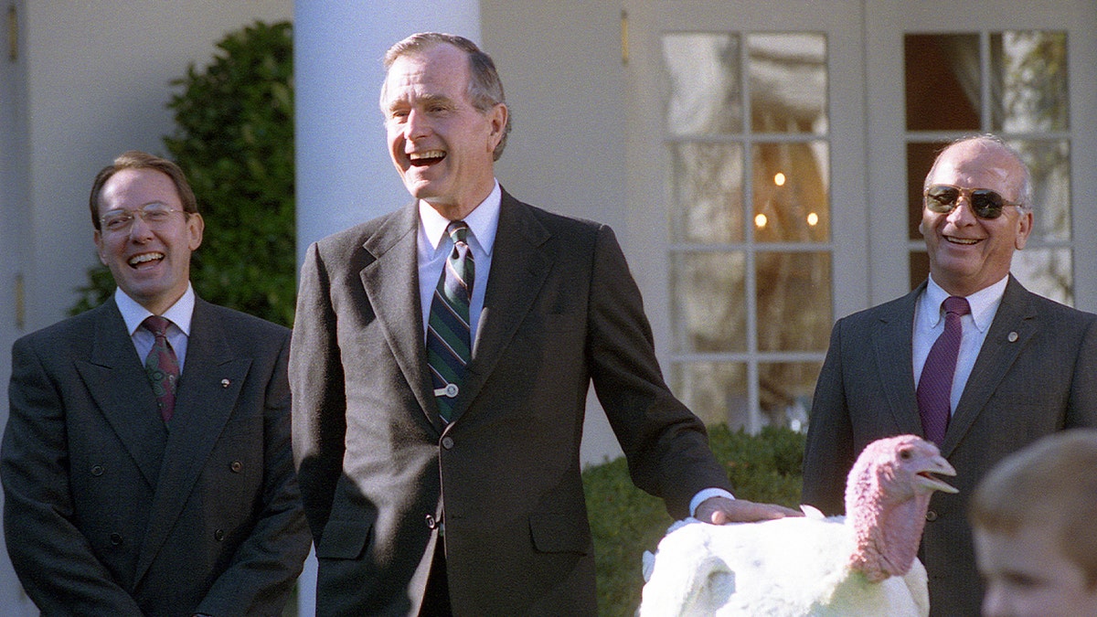 President George H.W. Bush participates in the presentation and pardoning of the National Thanksgiving Turkey in the Rose Garden of the White House.