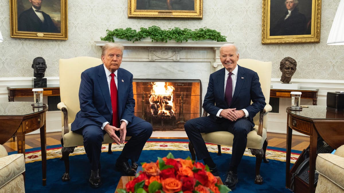 Trump and Biden wideshot in Oval Office by fireplace