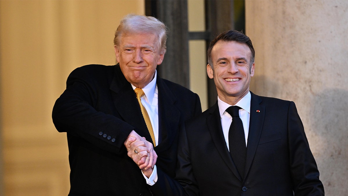 French President Emmanuel Macron (R) shakes hands as he welcomes U.S. President-elect Donald Trump (L) before a meeting at the Élysée Presidential Palace in Paris, France, on December 7, 2024.