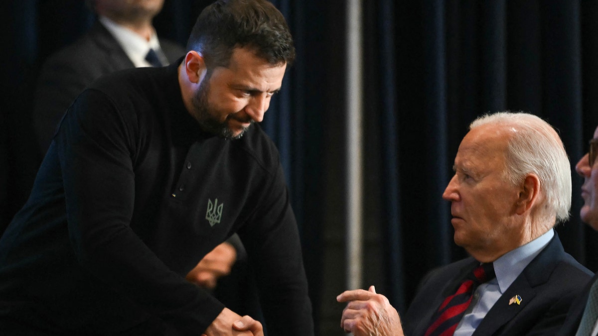 Zelenskyy, left, shaking hands with President Biden, right