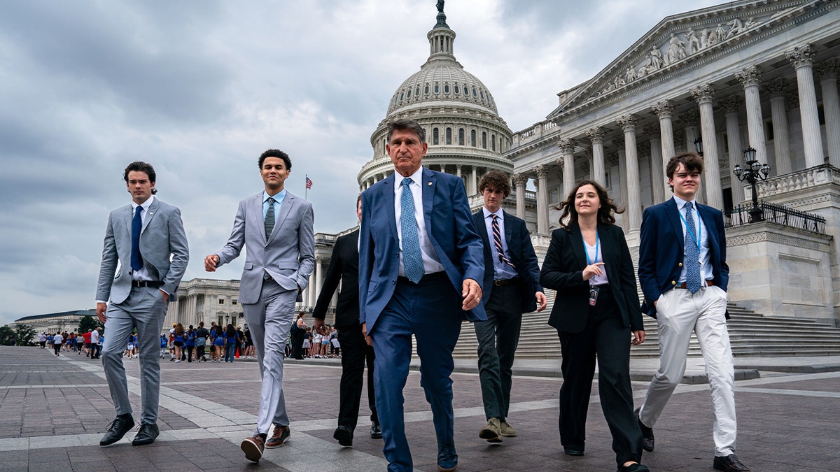 Manchin and staffers