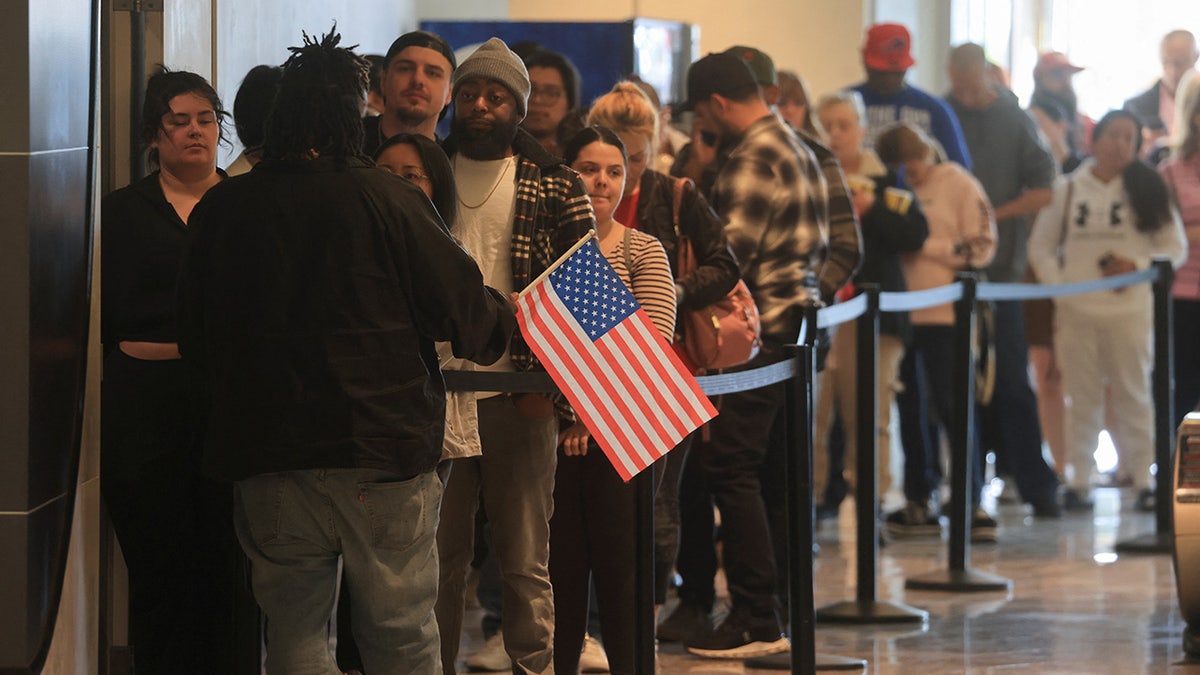 People stand in line to vote the 2024 U.S. presidential election on Election Day