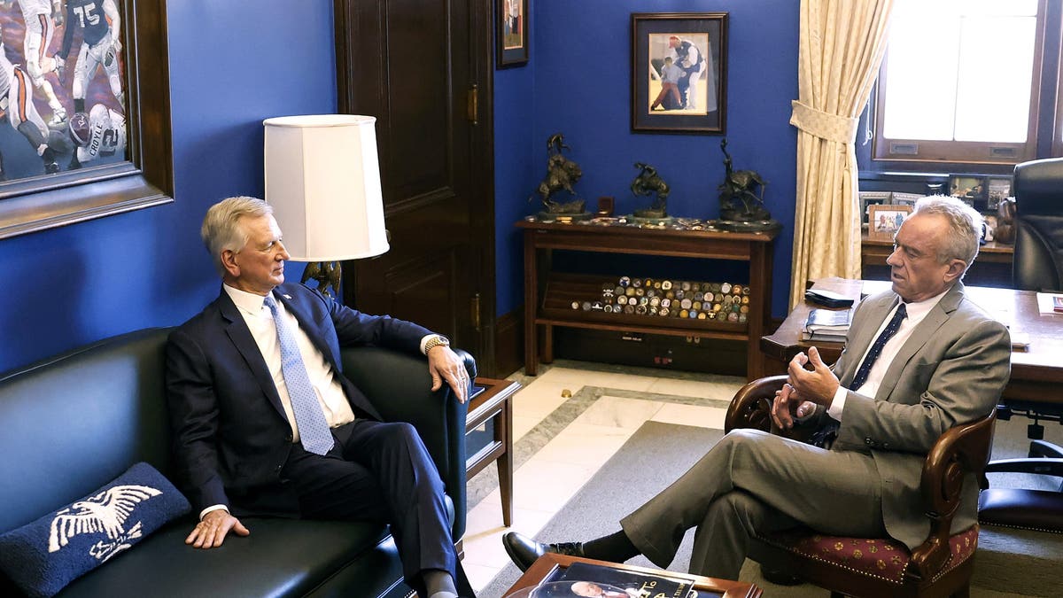 Robert F. Kennedy Jr., President-elect Donald Trump's nominee to be secretary of Health and Human Services, meets with Sen. Tommy Tuberville (R-AL), left, in the Senate Office Building on Dec. 17, 2024 in Washington, D.C.