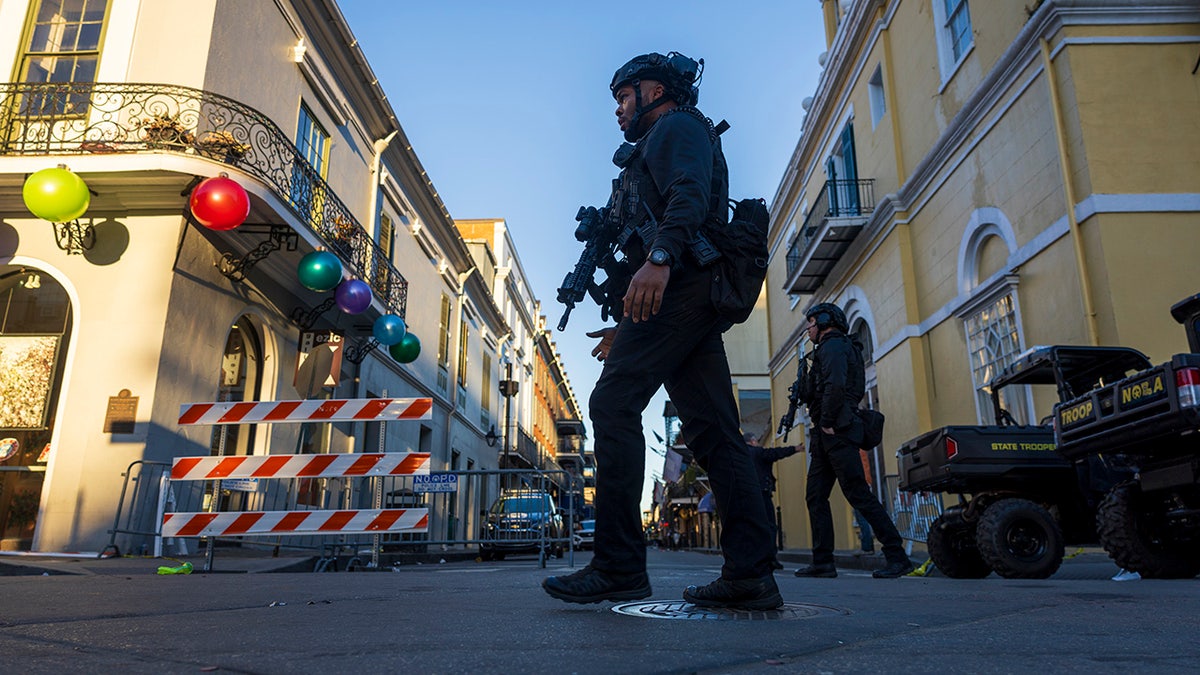 Police walk crime scene on Bourbon Street