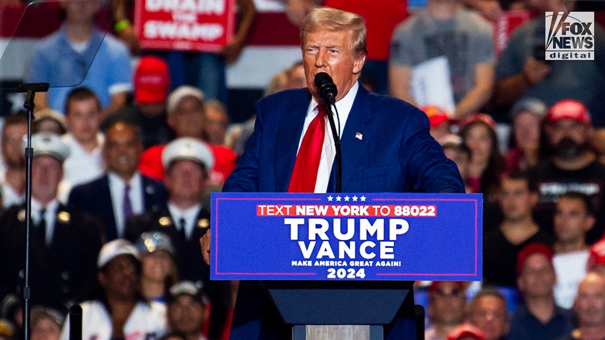 Donald Trump at lectern at campaign rally 