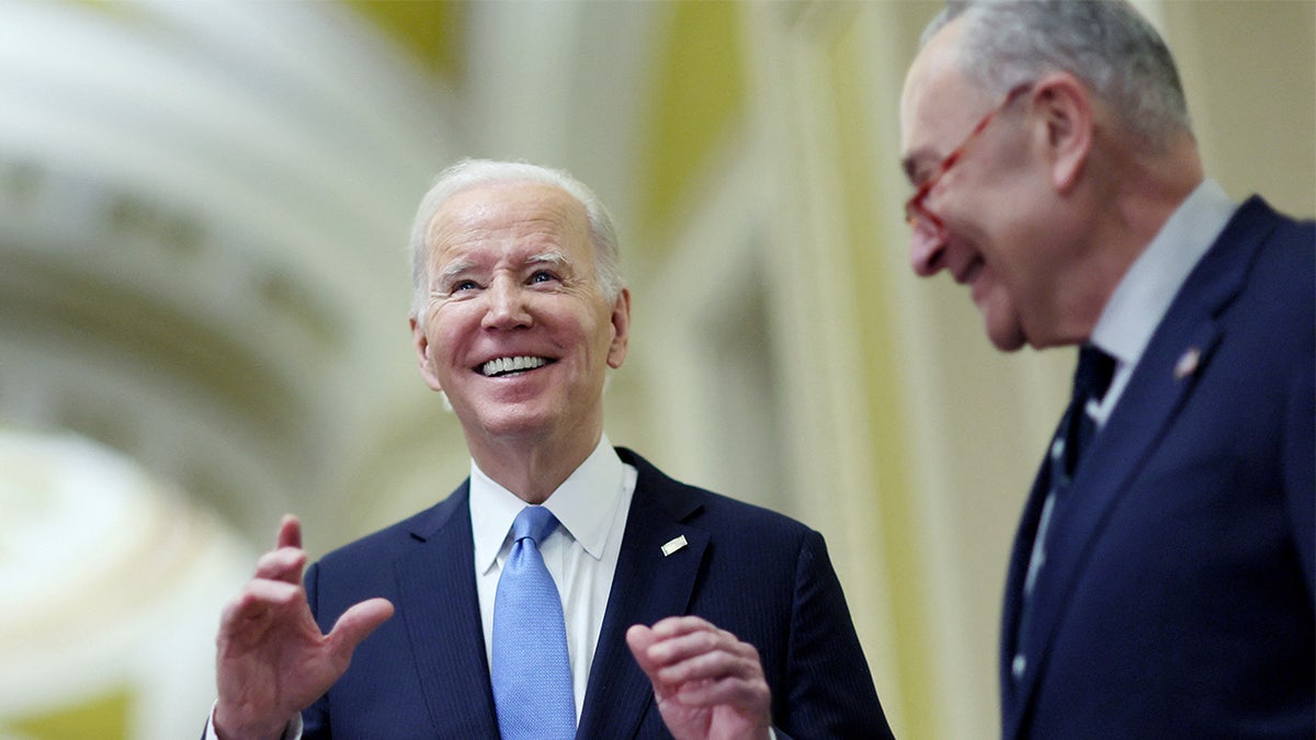 President Biden, left, with Chuck Schumer, right