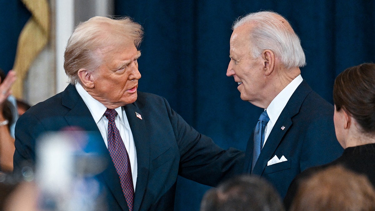 President Donald Trump speaks with President Joe Biden at his inauguration