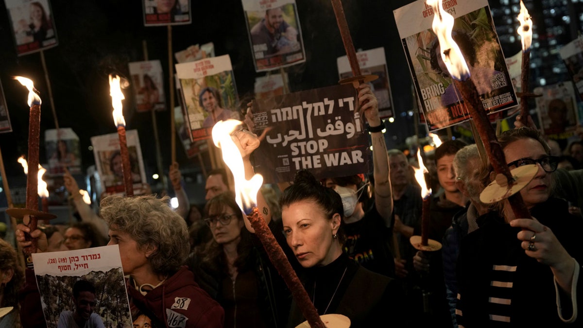 Relatives and friends of people killed and abducted by Hamas and taken into Gaza react to the ceasefire announcement as they take part in a demonstration in Tel Aviv, Israel, on Wednesday.