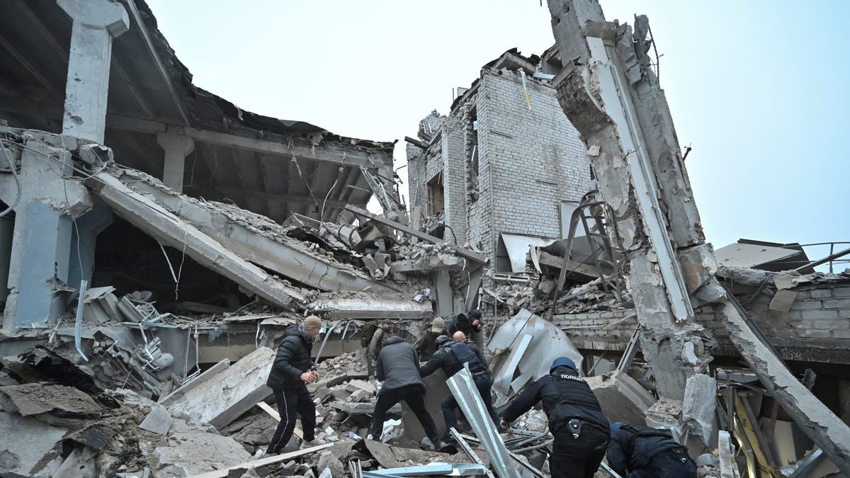 Russian missile strike on Ukraine: officers search through rubble