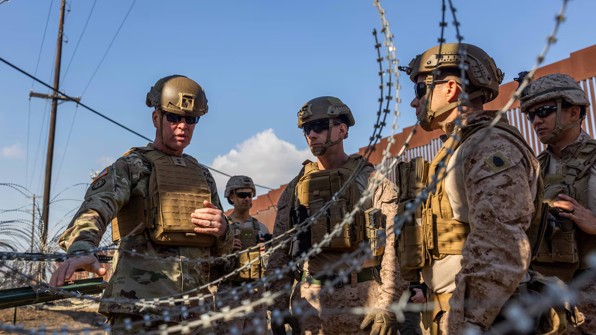 Army Maj. Gen. Henry S. Dixon, left, talks with Marines near San Ysidro, California, Jan. 28, 2025. U.S. Northern Command is working with Homeland Security to add additional security to curtail illegal border crossings.