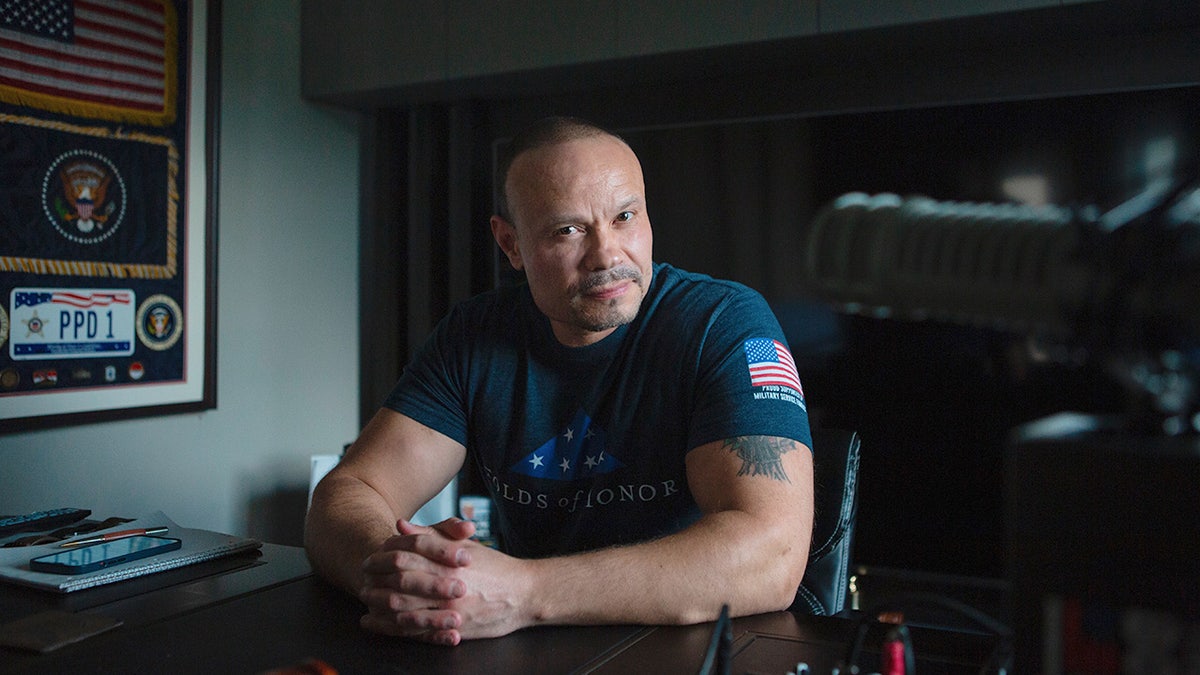 Dan Bongino with his hands folded