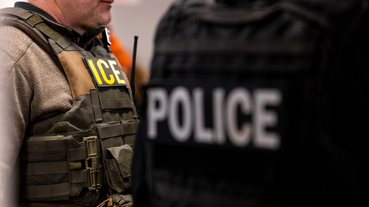 US Immigration and Customs Enforcement (ICE) agents, along with other federal law enforcement agencies, attend a pre-enforcement meeting