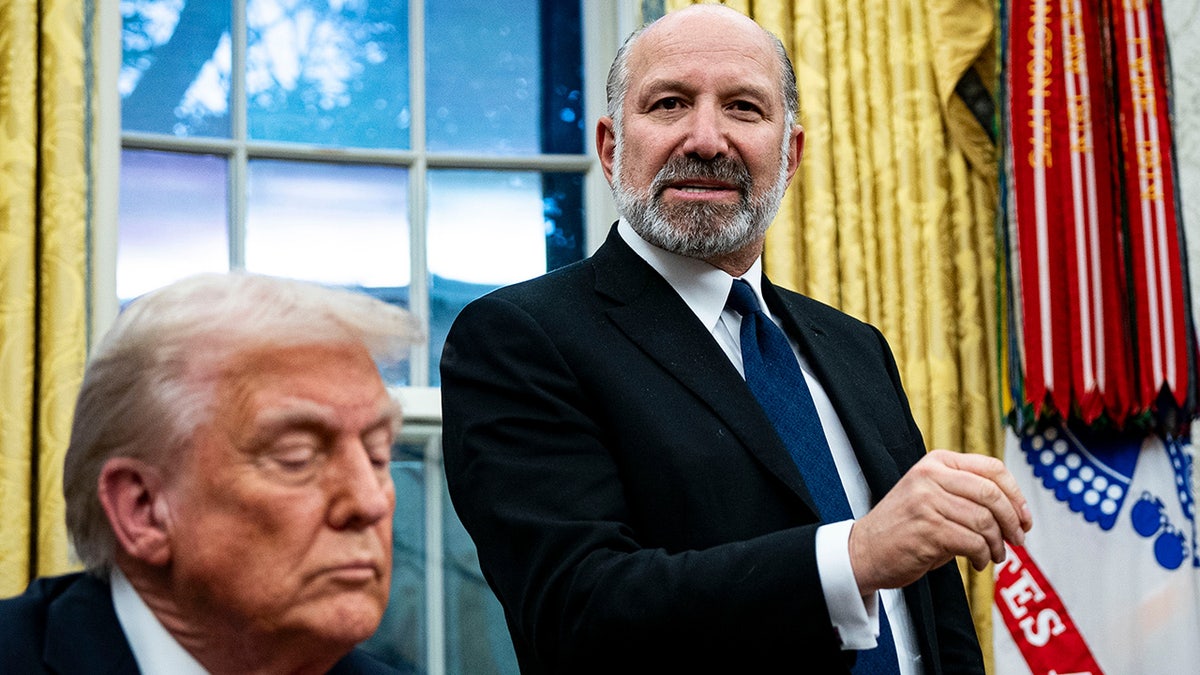 Howard Lutnick, chief executive officer of Cantor Fitzgerald LP and US commerce secretary nominee for US President Donald Trump, right, and President Donald Trump during an executive order signing in the Oval Office of the White House in Washington, DC, US, on Monday, Feb. 10, 2025. Trump ordered a 25% tariff on steel and aluminum imports, escalating his efforts to protect politically important US industries with levies hitting some of the country's closest allies. Photographer: Al Drago/Bloomberg via Getty Images