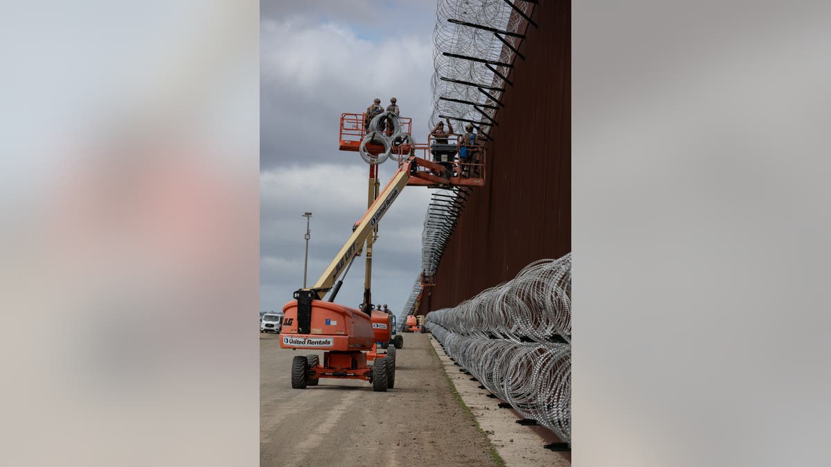 Marines installing concertina wire on border wall