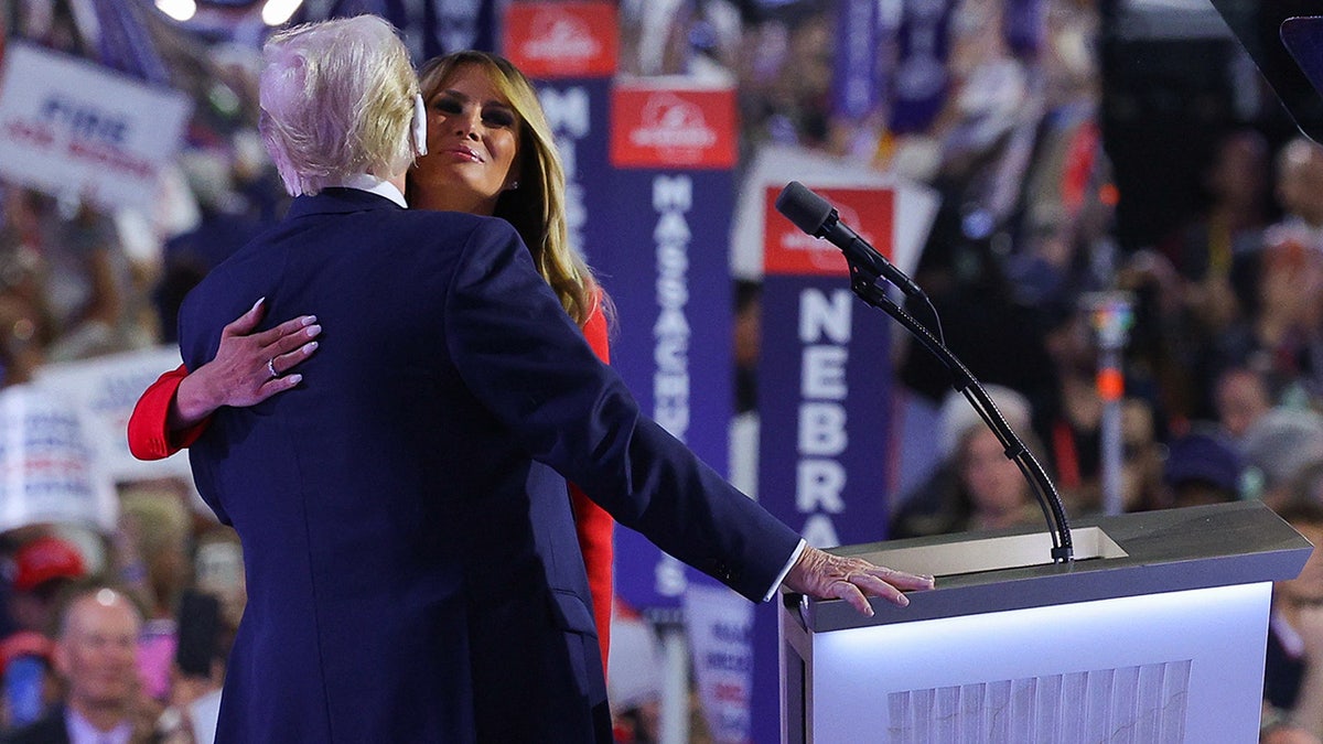 Trump embracing wife Melania