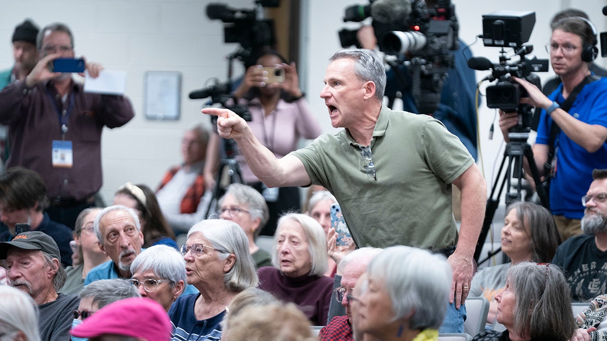 Man shouts at Rep. Chuck Edwards during town hall event