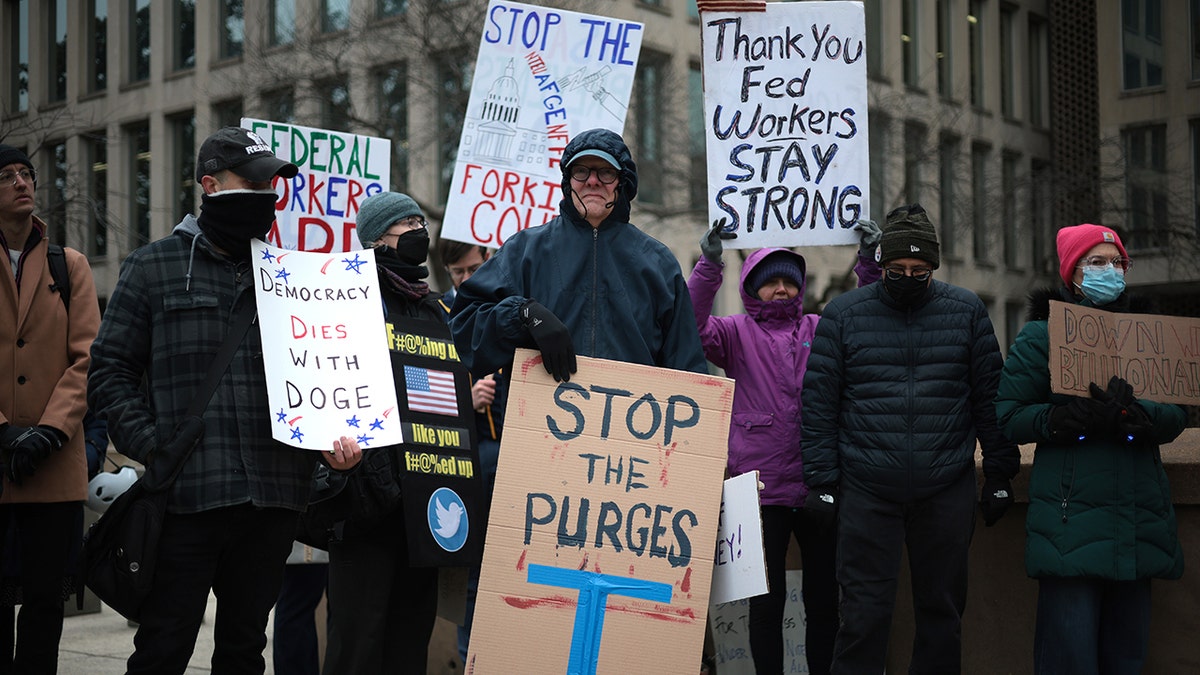 people protesting firings of federal workers