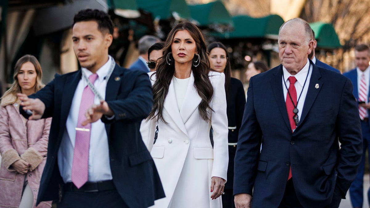 Homan and Noem walk in Washington