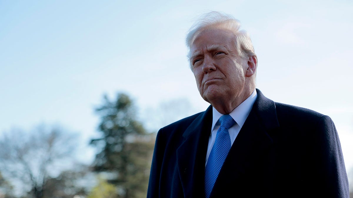 Trump speaks to reporters outside the White House before boarding Marine One