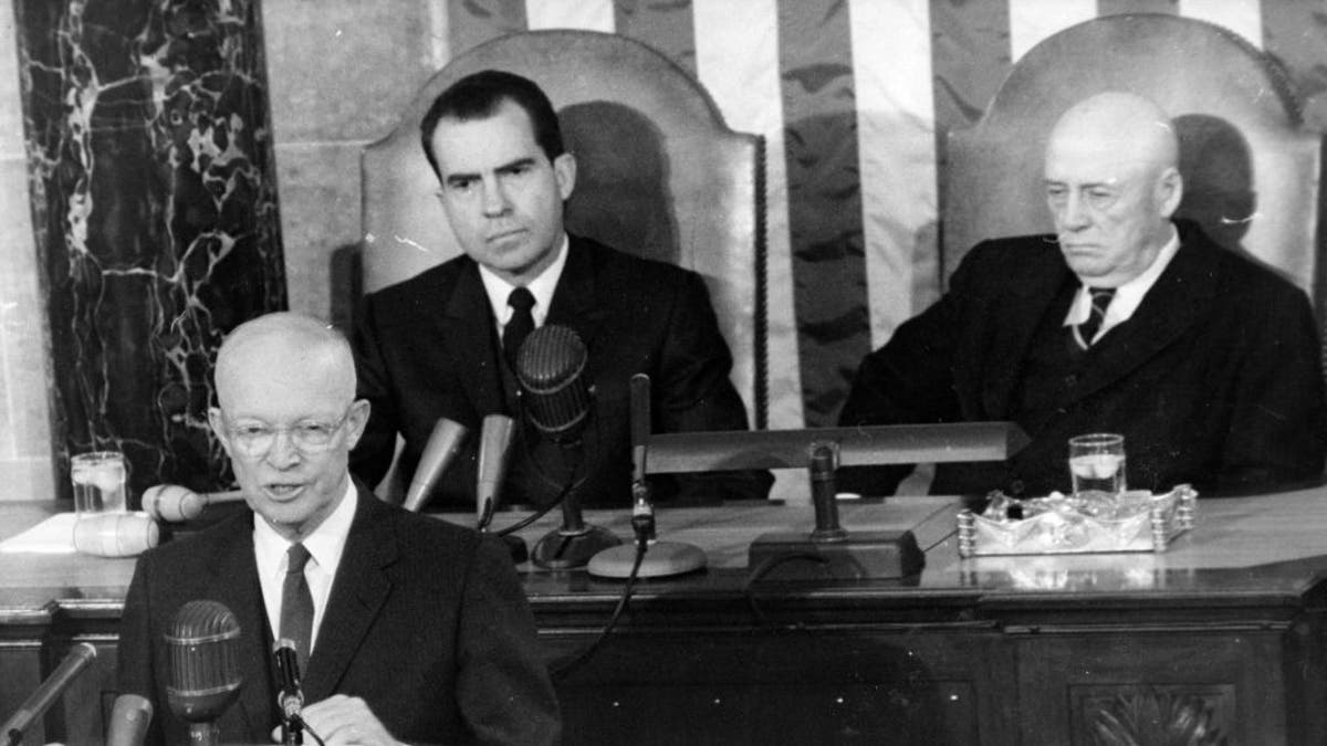 President Dwight D. Eisenhower (1890-1969) gives his State of the Union address to Congress in Washington, D.C., January 1960. Behind him, on the left, is Vice President Richard Nixon and House Speaker Sam Rayburn, D-TX.