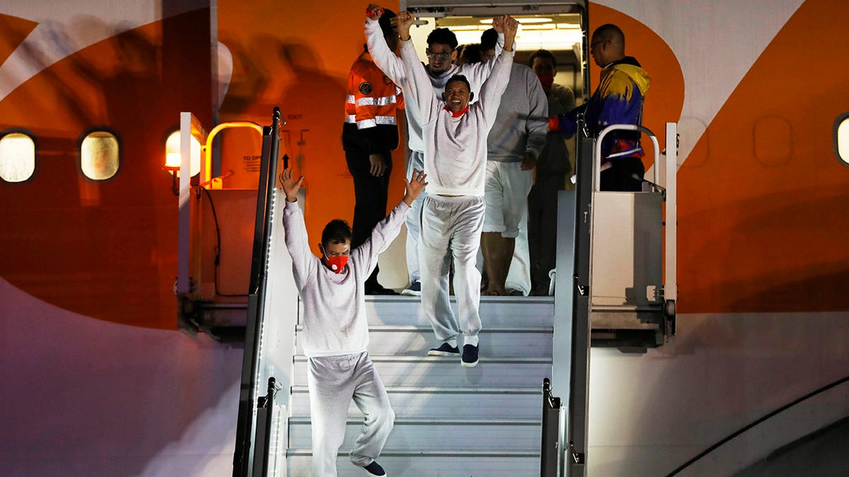 Venezuelan migrants getting off a plane