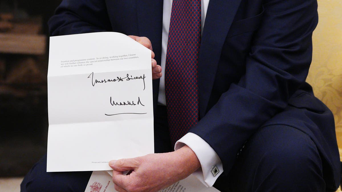 Trump holding King Charles letter