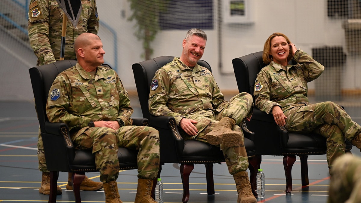 Col. Susan Meyers is pictured sitting with other officers.