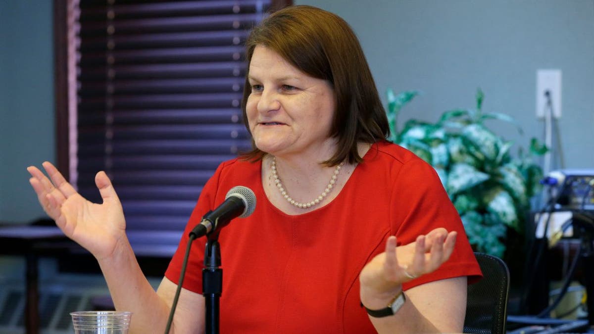 Milwaukee County Circuit Court Judge Hannah Dugan speaking raising her hands