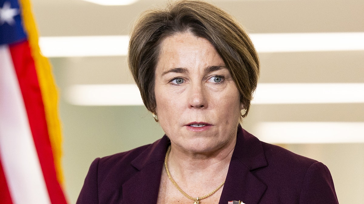 Maura Healey wearing a purple jacket