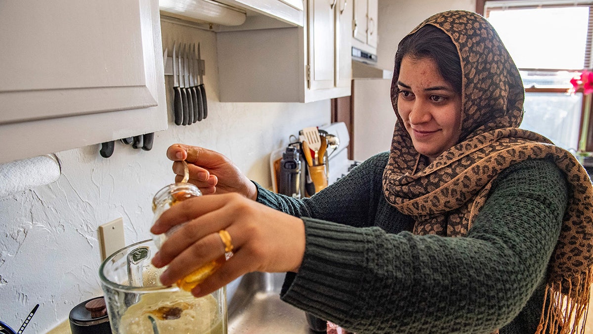 Afghan evacuee in her Massachusetts apartment