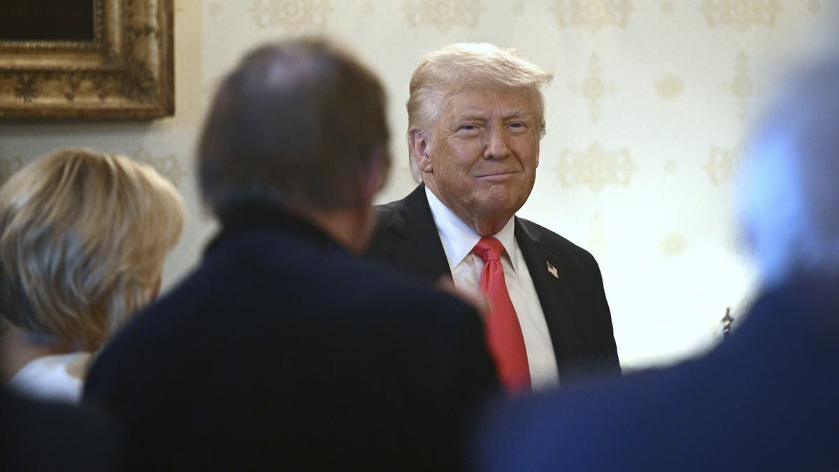 President Donald Trump attends an Easter prayer service and dinner in the Blue Room of the White House in Washington, Wednesday, April 16, 2025. (Pool via AP)