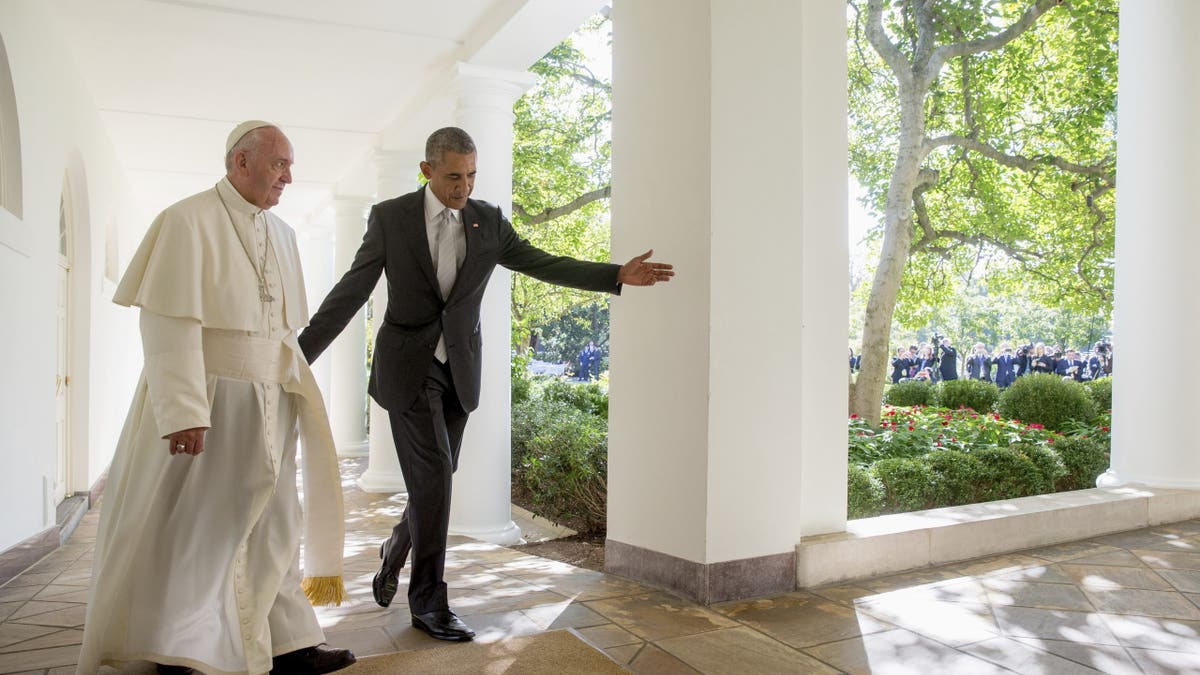 President Barack Obama and Pope Francis walk down the Colonnade before meeting in the Oval Office of the White House in Washington on Sept. 23, 2015.