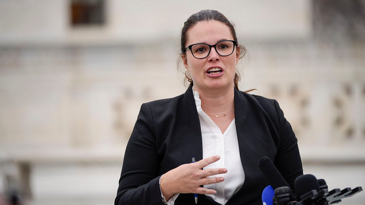 Allison Riggs speaks to reporters in Washington about redrawing of NC congressional maps