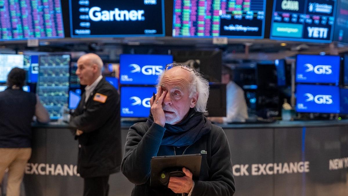 Traders work on the floor of the New York Stock Exchange (NYSE) on March 28, 2025, in New York City. As President Trump's escalating trade war and fresh signs of reinvigorated inflation concern investors, the Dow Jones Industrial Average (DJI) dropped more than 700 points or nearly 1.7%. (Photo by Spencer Platt/Getty Images)