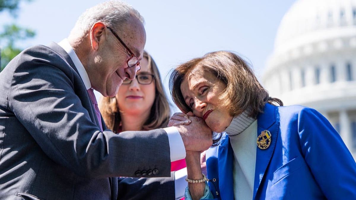 UNITED STATES - APRIL 29: Rep. Nancy Pelosi, D-Calif., greets Senate Minority Leader Charles Schumer, D-N.Y., as Rep. Sarah McBride, D-Del., looks on, during a news conference to reintroduce the Equality Act, outside the U.S. Capitol on Tuesday, April 29, 2025. The bill prohibits discrimination based on "sex, sexual orientation, and gender identity." (Tom Williams/CQ-Roll Call, Inc via Getty Images)