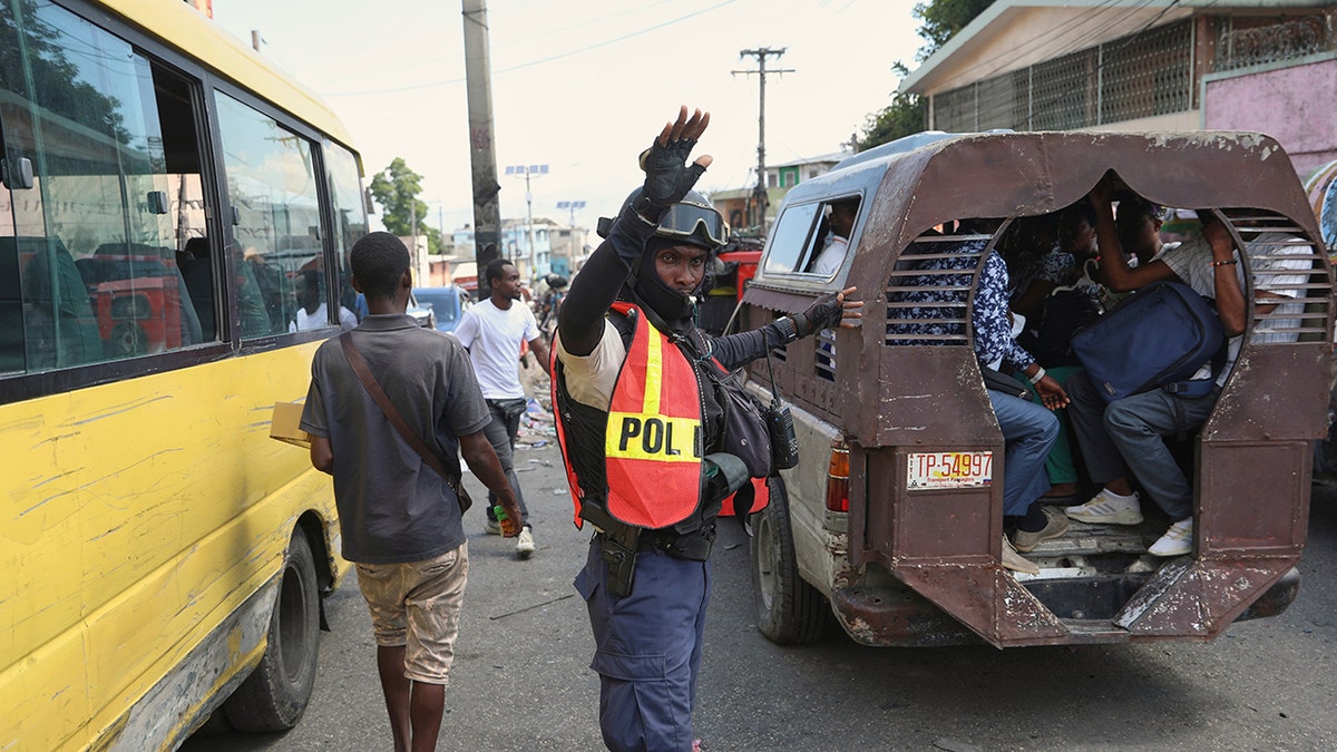 Haitian police officer in the street