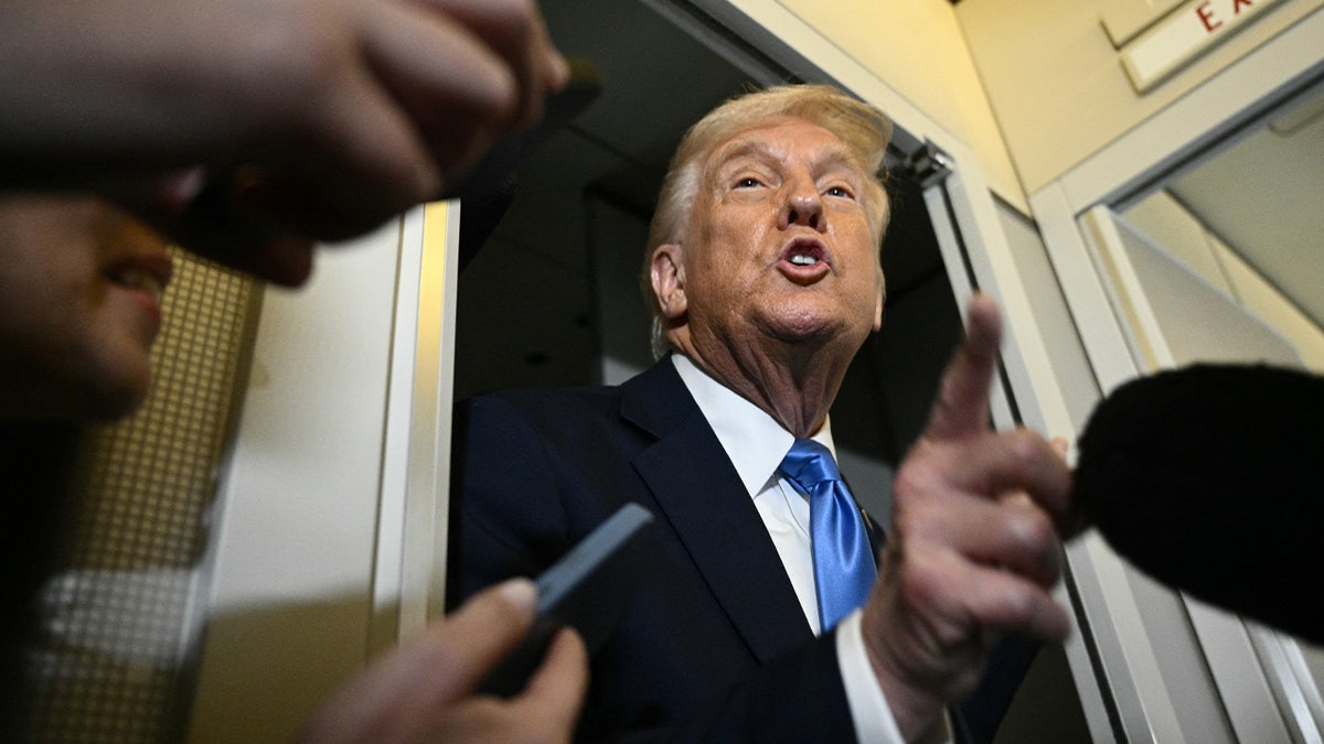 Trump talking to press gaggle on Air Force One