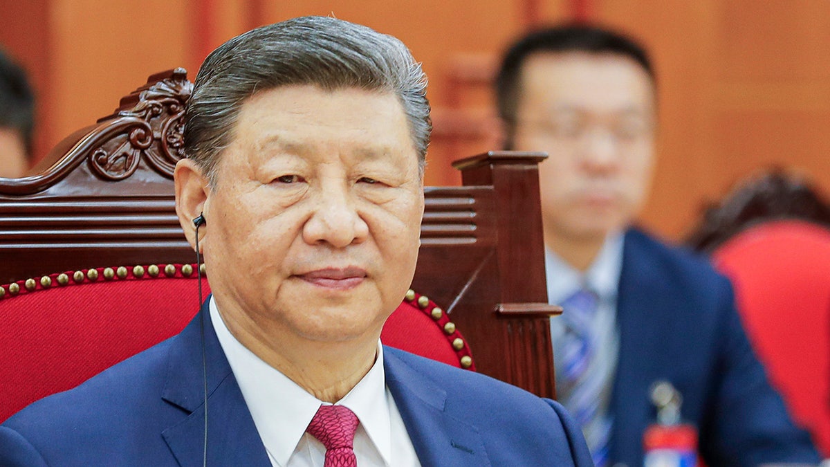 Chinese President Xi Jinping listens as Vietnamese Prime Minister Pham Minh Chinh, not pictured, speaks during their meeting at the Office of the Party Central Committee in Hanoi, Vietnam, on Monday, April 14. 