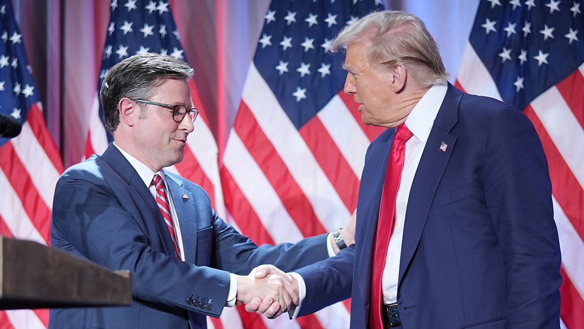 Speaker Johnson, President Trump shaking hands