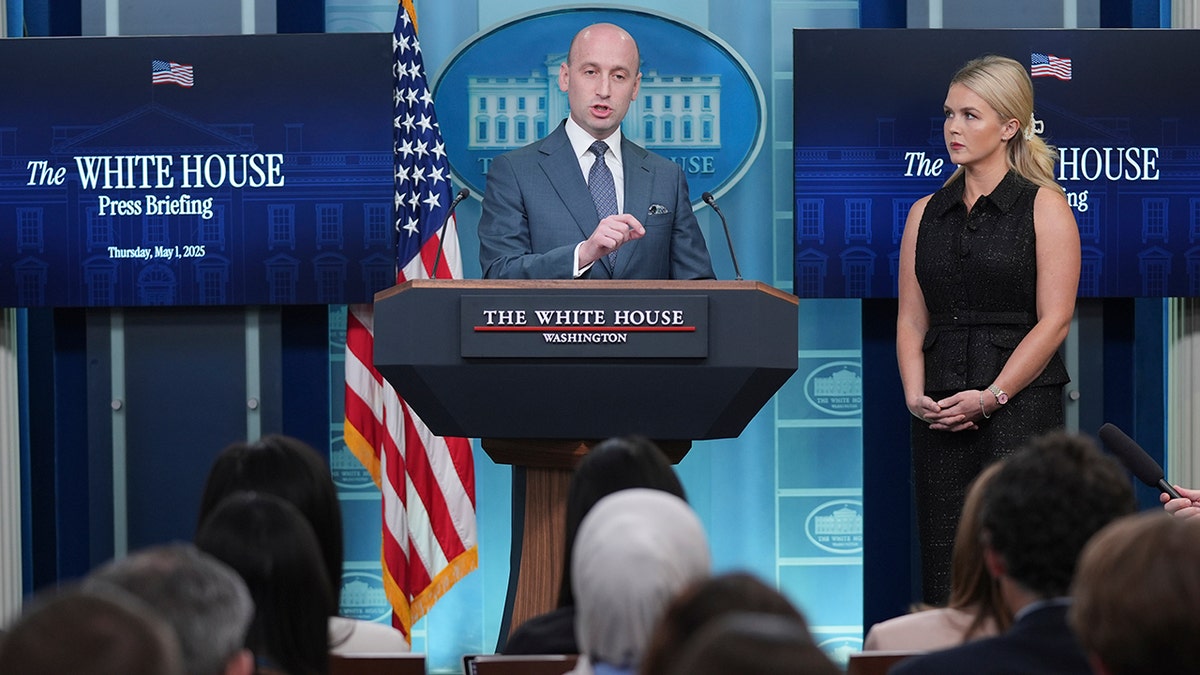 Karoline Leavitt and Stephen Miller speaking at the White House briefing
