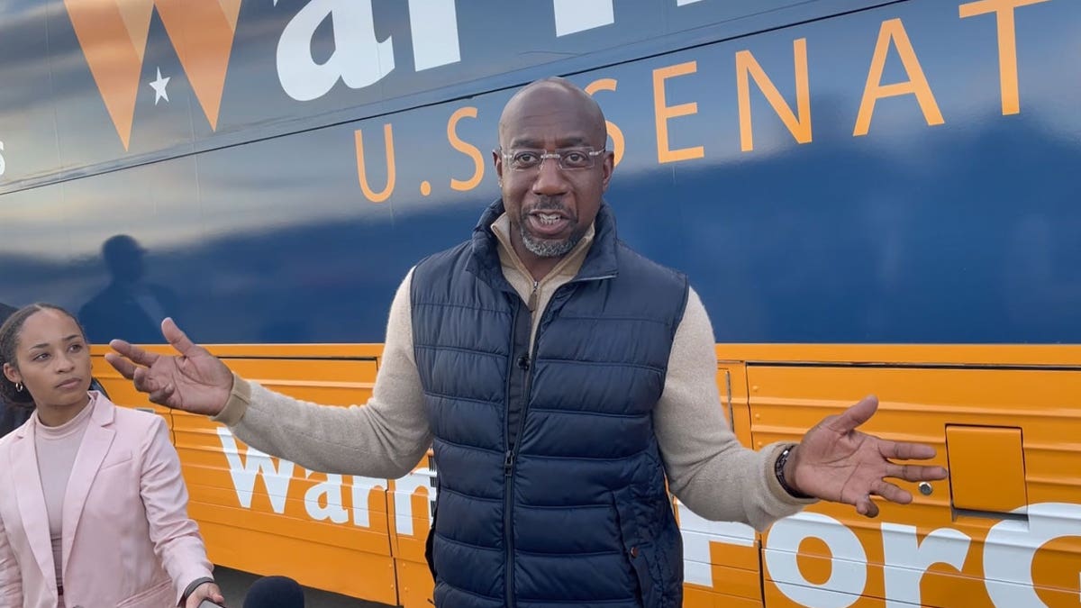 Democratic Georgia Sen. Raphael Warnock speaking outside to reporters