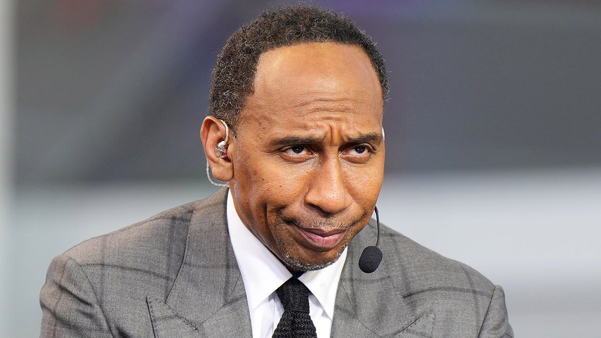 Stephen A Smith wearing a grey suit