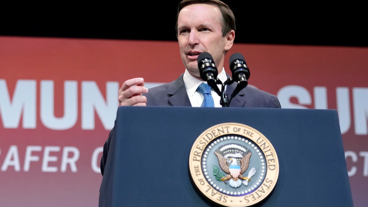 Chris Murphy speaking at a podium