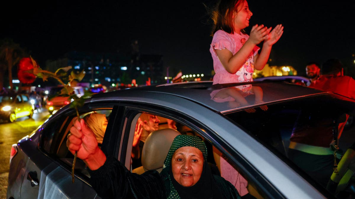 People celebrate after U.S. President Donald Trump said on Tuesday he would order the lifting of sanctions on Syria, in Damascus, Syria May 13 , 2025