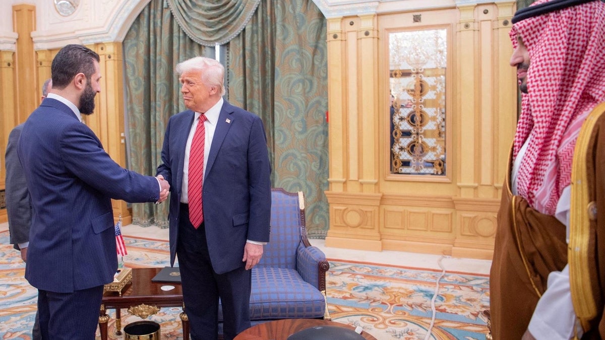U.S. President Donald Trump meets with Syrian President Ahmed al-Sharaa in Riyadh, Saudi Arabia, in this handout released on May 14, 2025. Saudi Press Agency/Handout via REUTERS   THIS IMAGE HAS BEEN SUPPLIED BY A THIRD PARTY